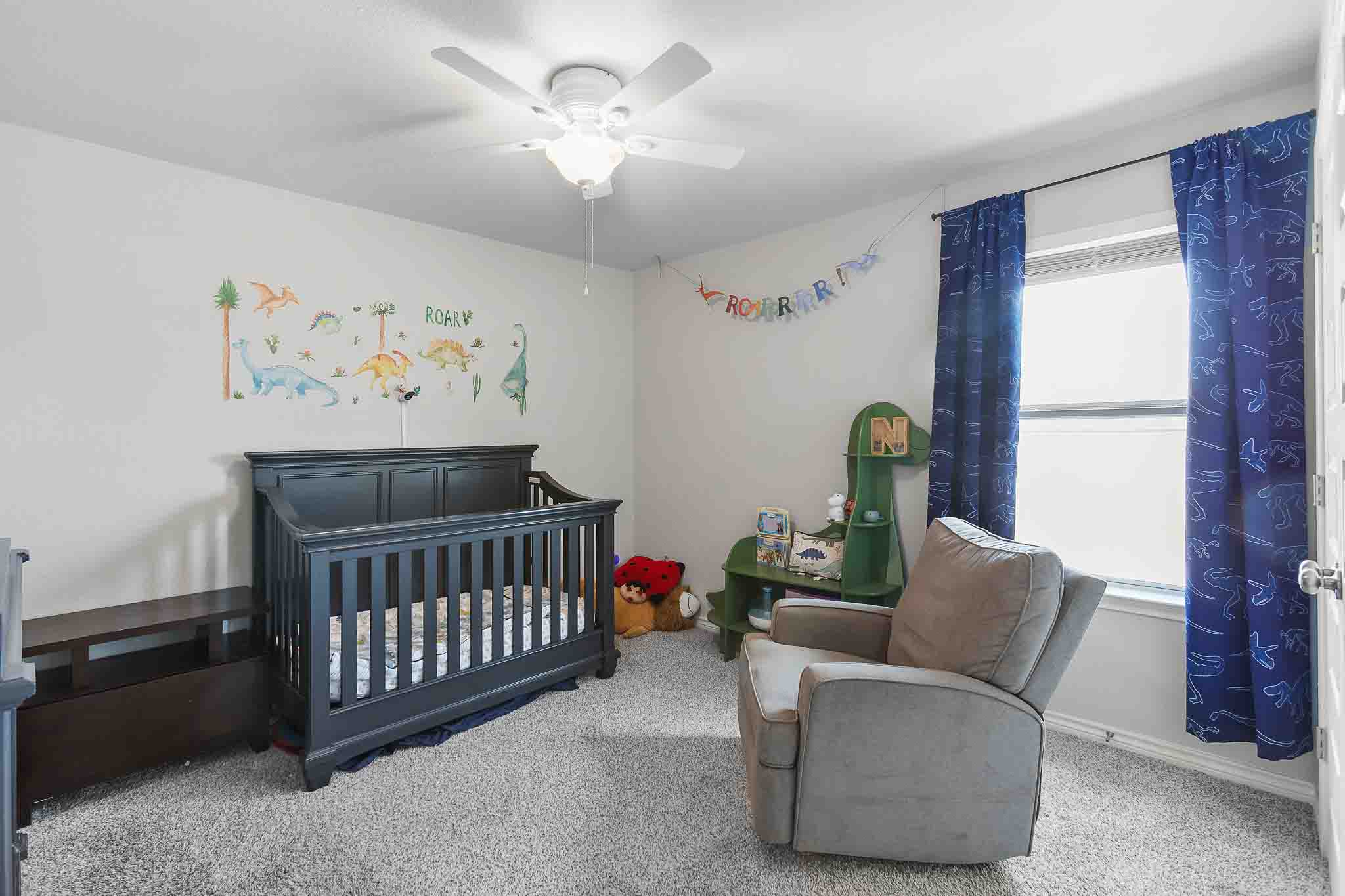 616 Barbary Coast Lane Jarrell, TX 76537 - Photo 25 of 37 a bedroom with furniture and a window