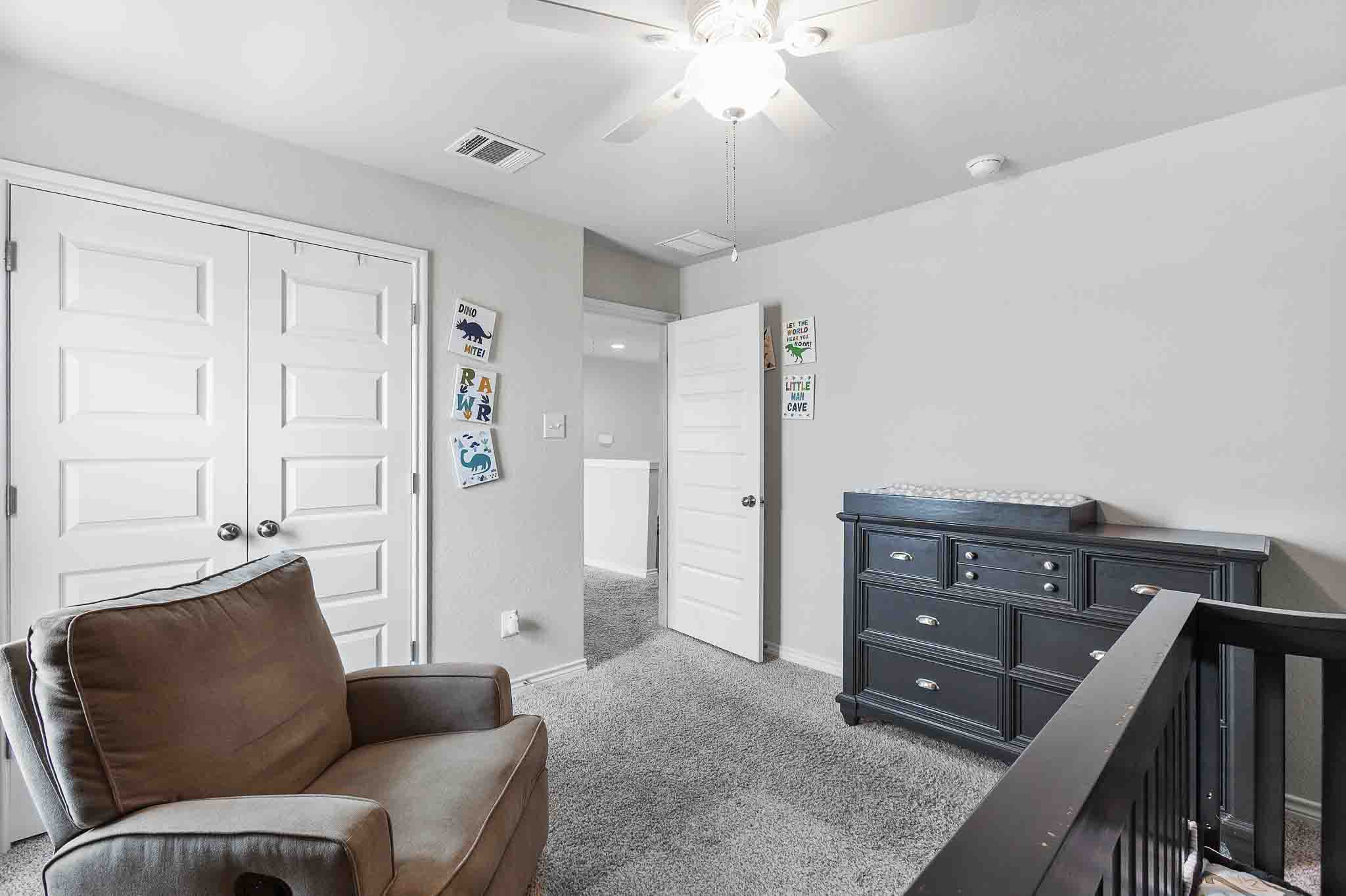 616 Barbary Coast Lane Jarrell, TX 76537 - Photo 26 of 37 a living room with furniture and a dresser