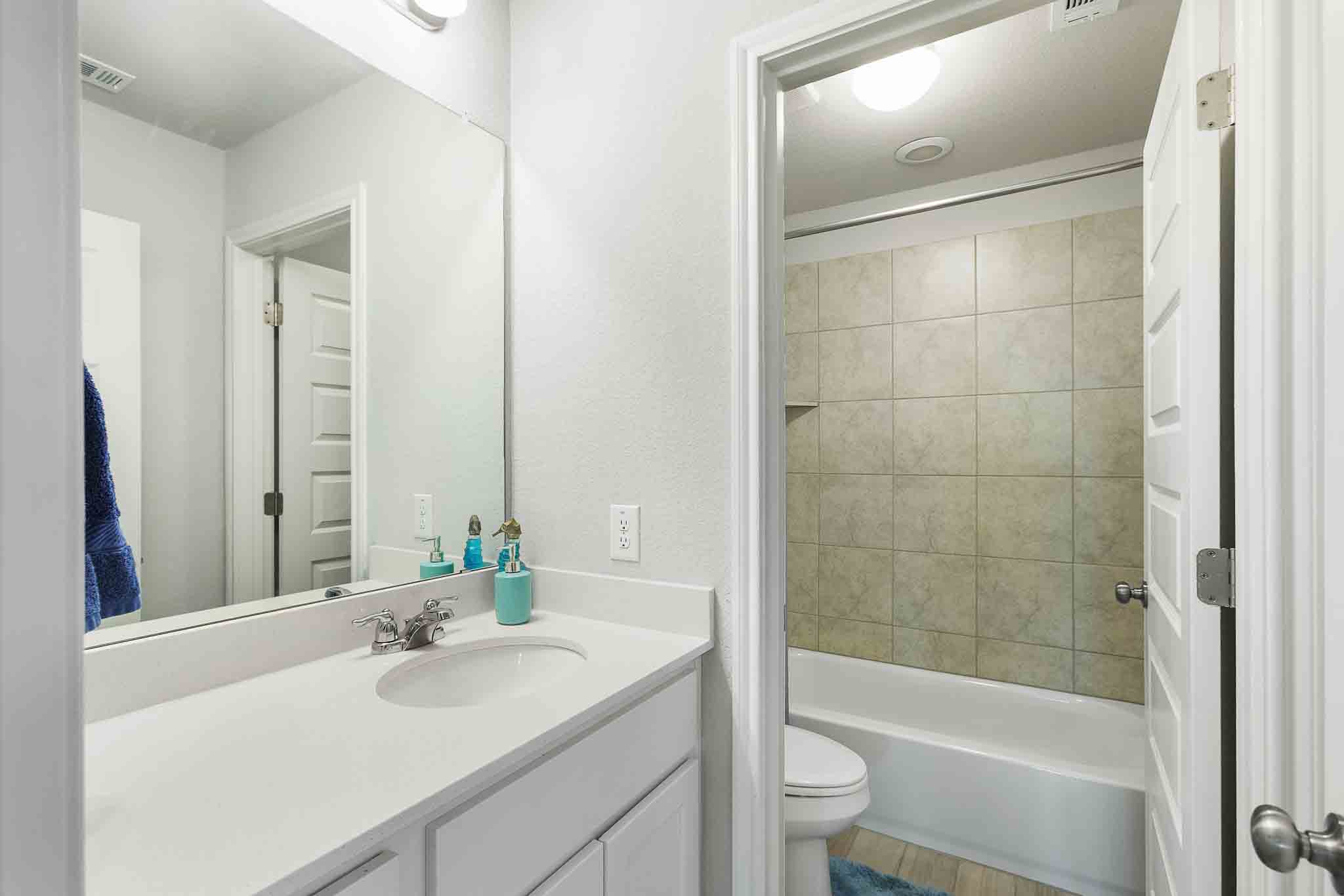 616 Barbary Coast Lane Jarrell, TX 76537 - Photo 31 of 37 a bathroom with a sink a toilet and shower
