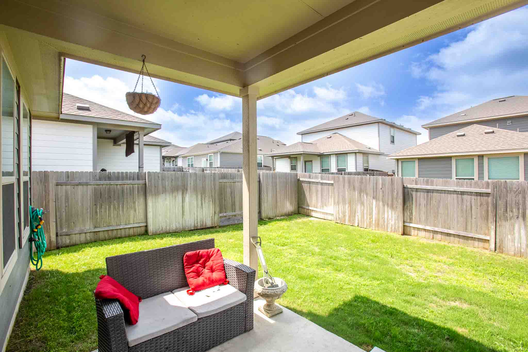 616 Barbary Coast Lane Jarrell, TX 76537 - Photo 32 of 37 a backyard of a house with yard and outdoor seating