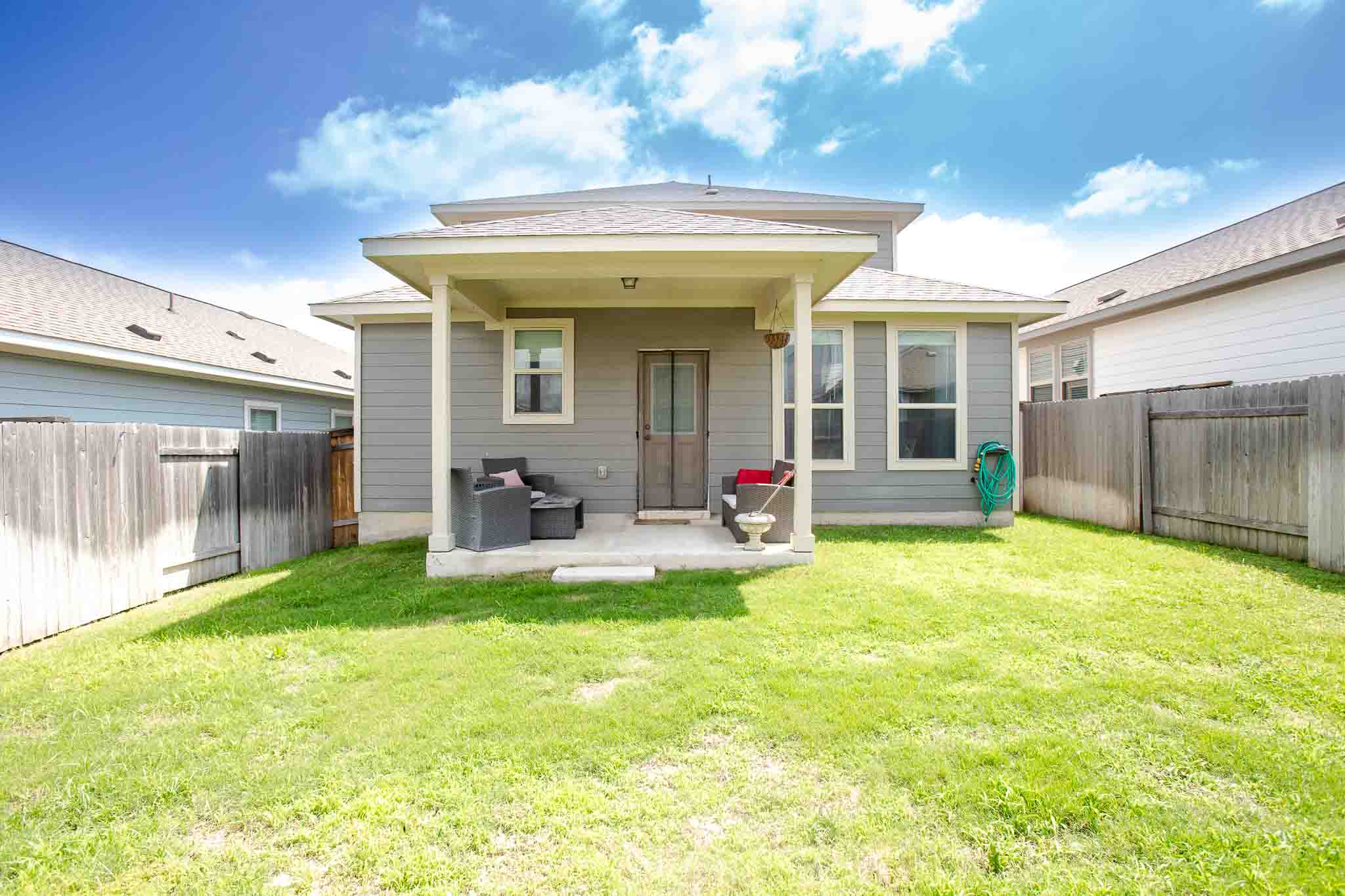 616 Barbary Coast Lane Jarrell, TX 76537 - Photo 35 of 37 a view of a house with backyard porch and furniture