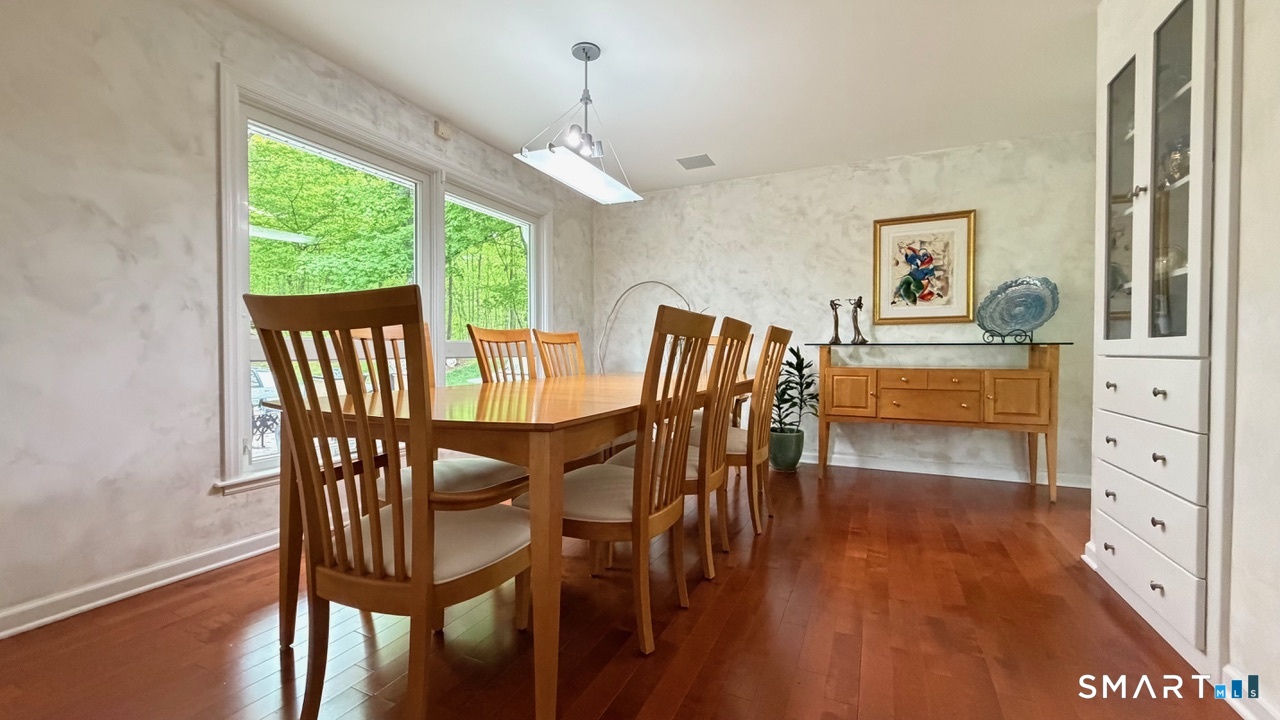 87 Warner Road Berlin, CT 06037 - Photo 11 of 22 a view of a dining room with furniture window and outside view