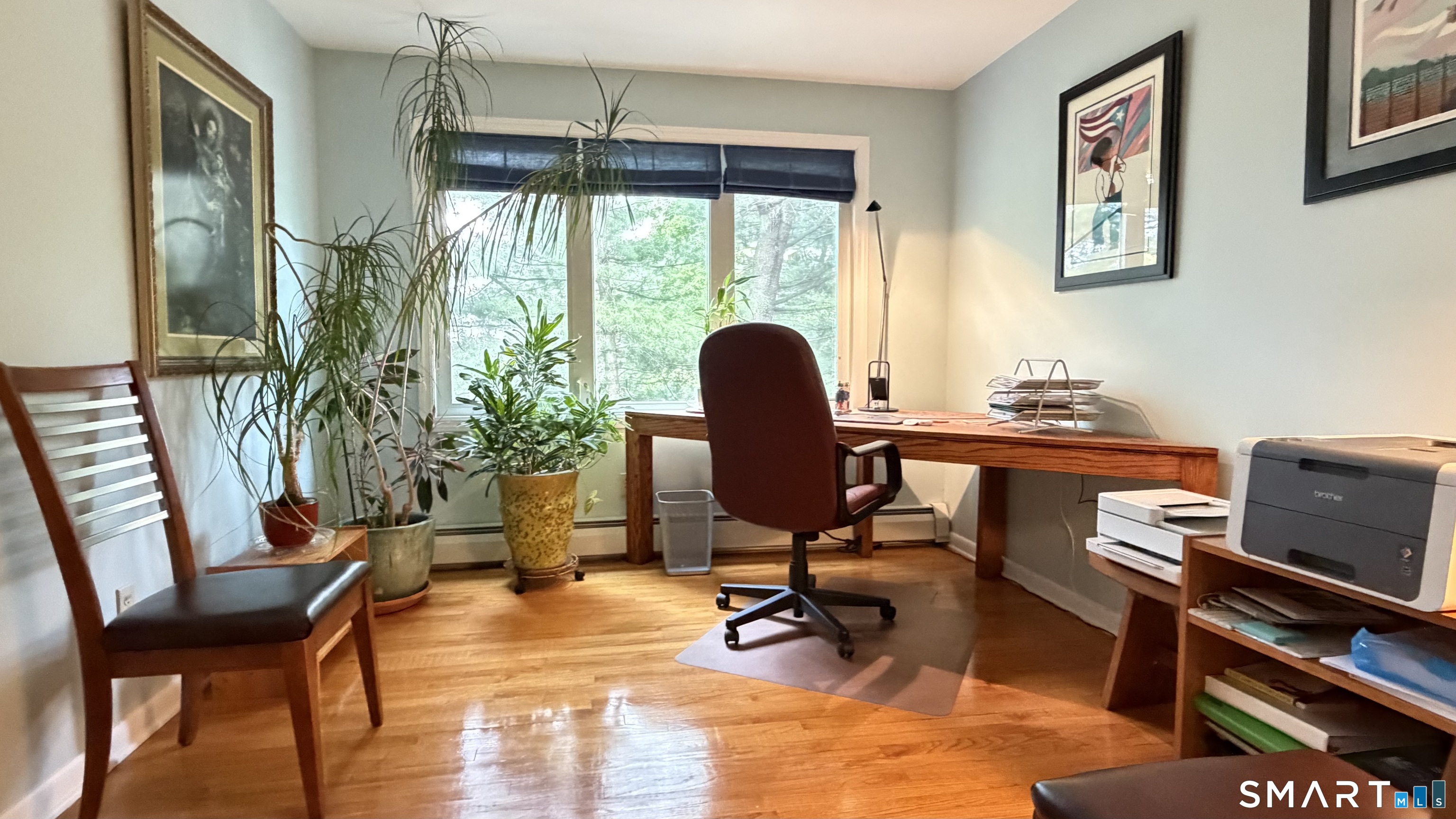 87 Warner Road Berlin, CT 06037 - Photo 15 of 22 a view of a workspace with furniture and a window