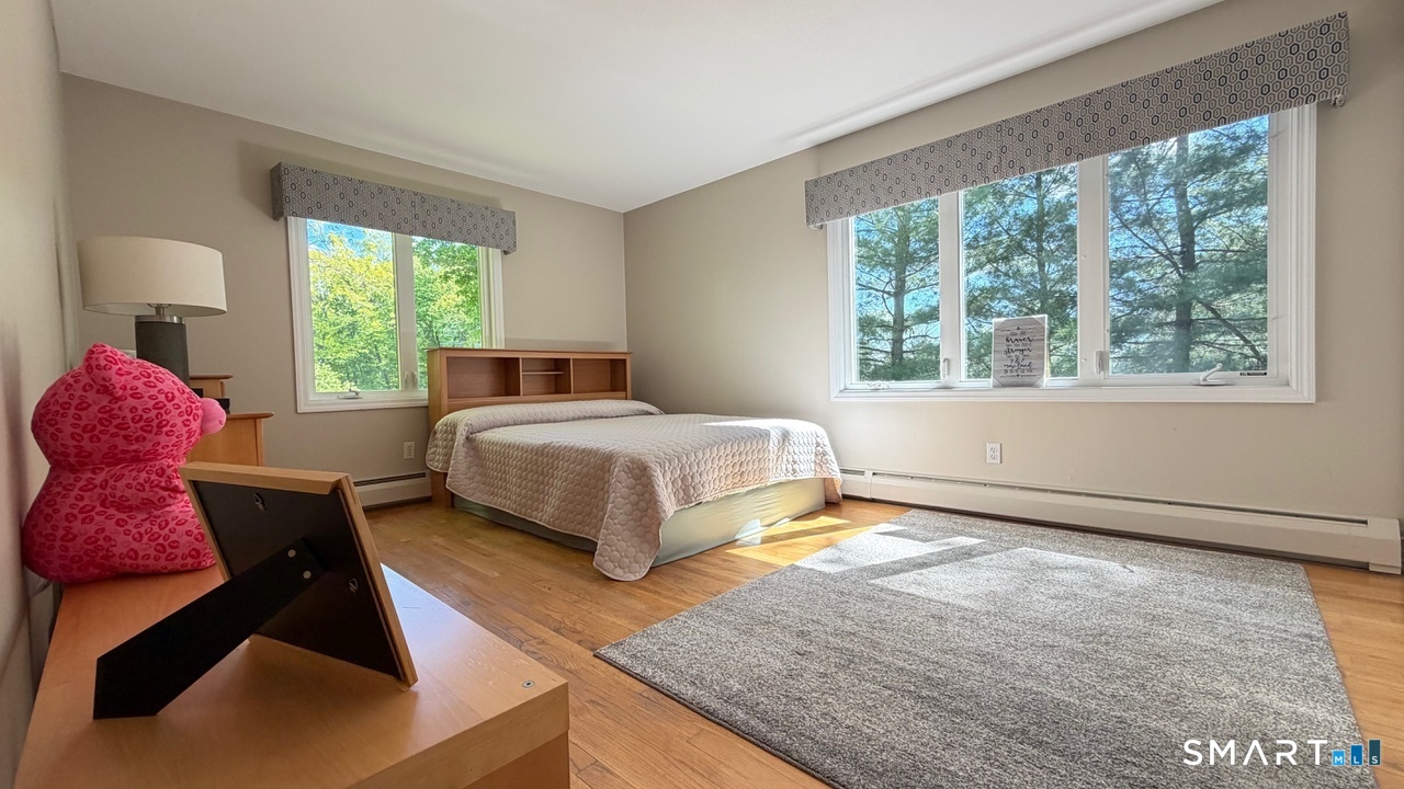 87 Warner Road Berlin, CT 06037 - Photo 16 of 22 a spacious bedroom with a bed and a window
