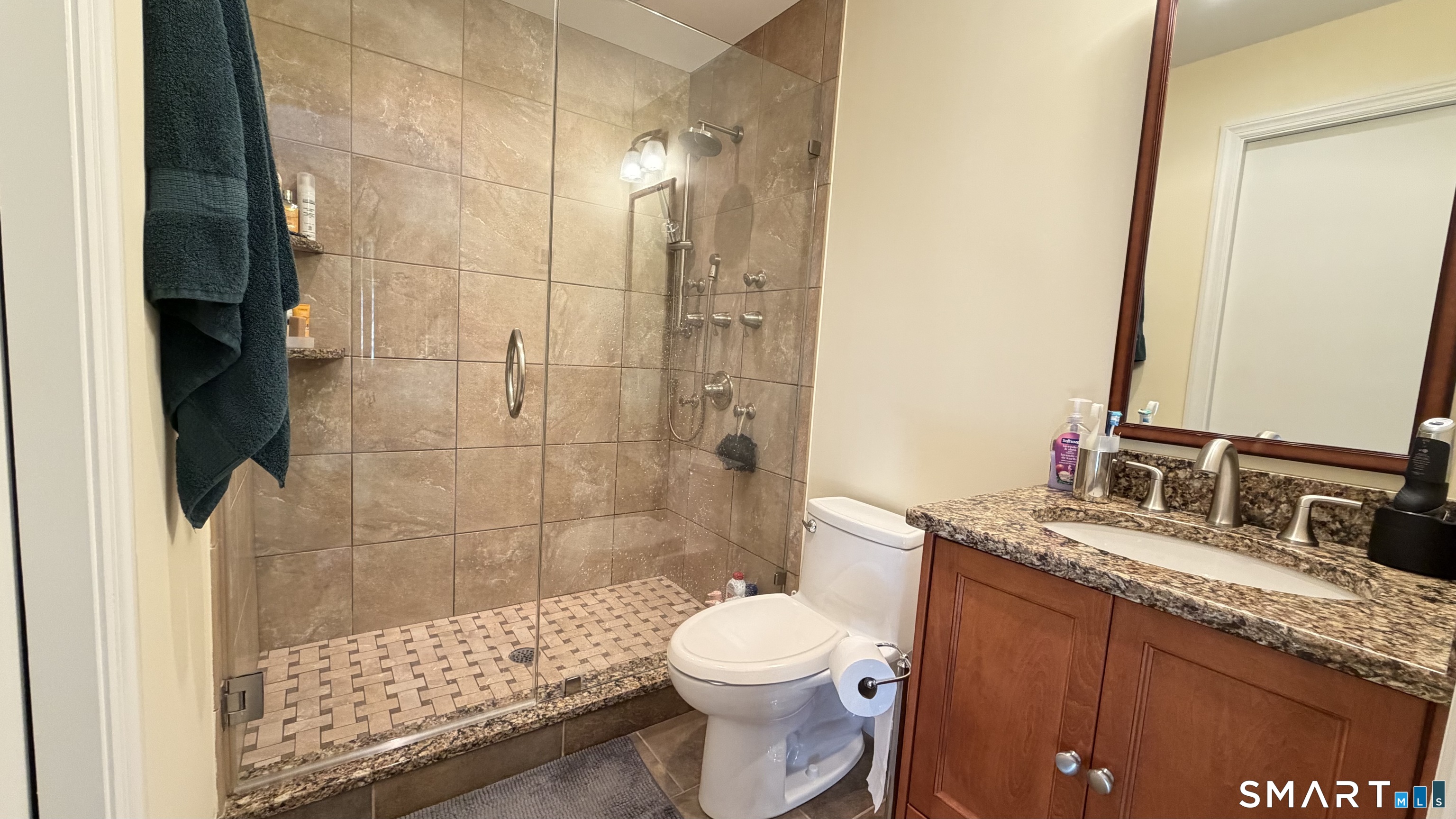 87 Warner Road Berlin, CT 06037 - Photo 18 of 22 a bathroom with a sink a toilet and shower