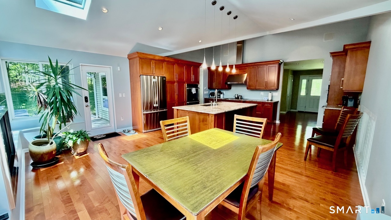 87 Warner Road Berlin, CT 06037 - Photo 8 of 22 a view of a dining room with furniture window and wooden floor