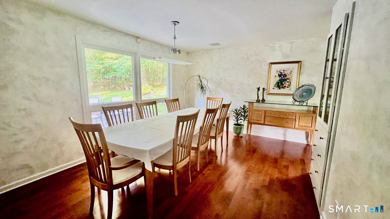 87 Warner Road Berlin, CT 06037 - Photo 10 of 22 a view of a dining room with furniture window and wooden floor
