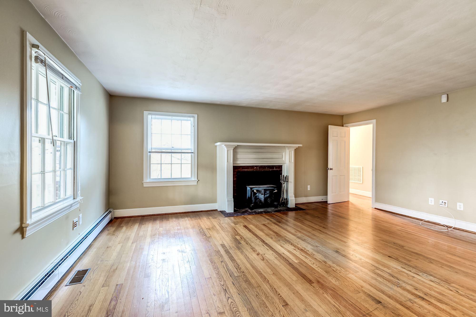9267 Patrick Street Upperville, VA 20184 - Photo 13 of 43 Light filled living room with fireplace