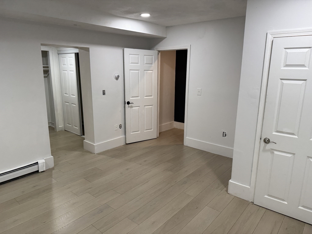 40 Crescent Chelsea Ma, Unit 2 Chelsea, MA 02150 - Photo 11 of 20 an empty room with wooden floor and closet