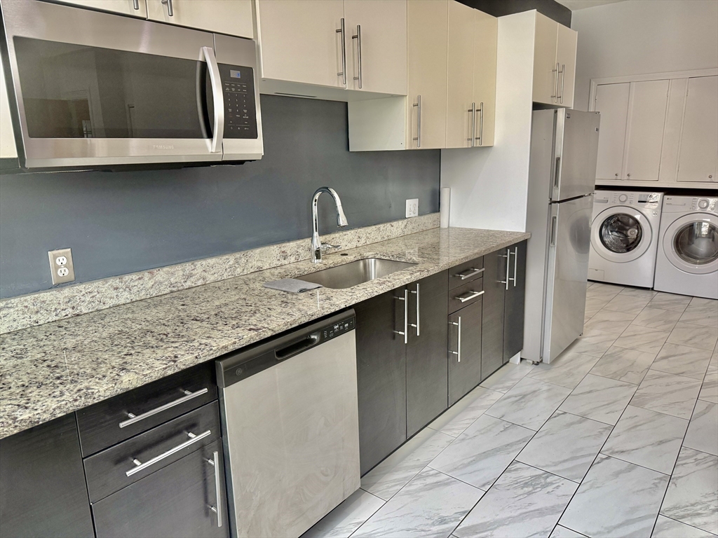40 Crescent Chelsea Ma, Unit 2 Chelsea, MA 02150 - Photo 18 of 20 a kitchen with stainless steel appliances granite countertop a sink and a microwave