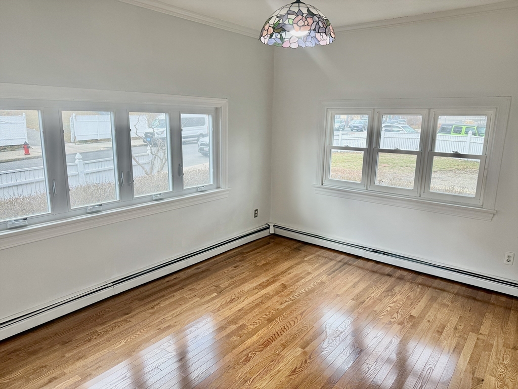 40 Crescent Chelsea Ma, Unit 2 Chelsea, MA 02150 - Photo 19 of 20 a view of an empty room with wooden floor and a window