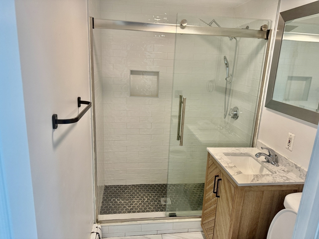 40 Crescent Chelsea Ma, Unit 2 Chelsea, MA 02150 - Photo 6 of 20 a bathroom with a sink toilet and shower