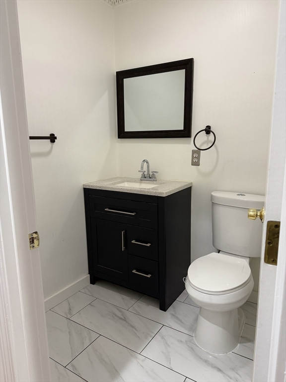 40 Crescent Chelsea Ma, Unit 2 Chelsea, MA 02150 - Photo 7 of 20 a bathroom with a toilet sink vanity and mirror