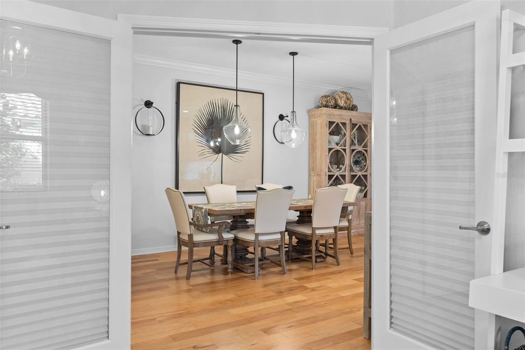 20219 Tesoro Drive Venice, FL 34293 - Photo 18 of 98 a view of a dining room with furniture window and wooden floor
