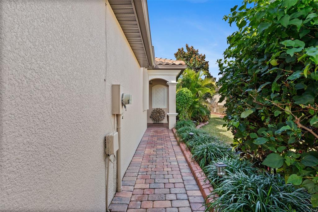 20219 Tesoro Drive Venice, FL 34293 - Photo 3 of 98 a view of a pathway with a house on both side