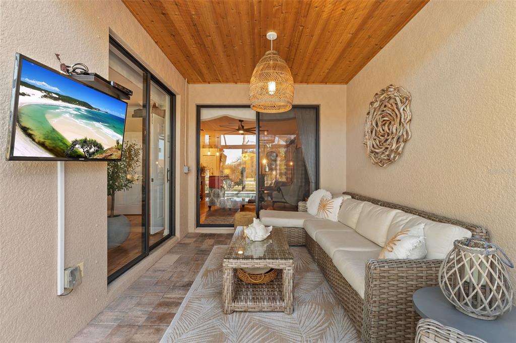 20219 Tesoro Drive Venice, FL 34293 - Photo 51 of 98 a living room with furniture and a flat screen tv