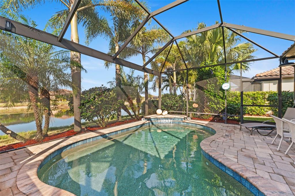 20219 Tesoro Drive Venice, FL 34293 - Photo 54 of 98 a swimming pool with outdoor seating and yard