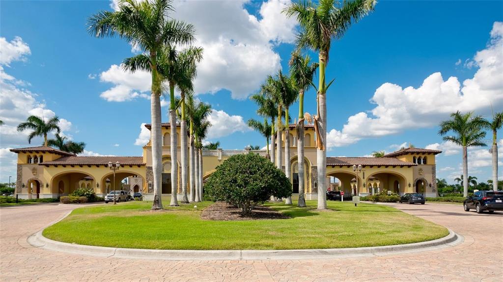 20219 Tesoro Drive Venice, FL 34293 - Photo 66 of 98 a view of a white house with a big yard and a fountain