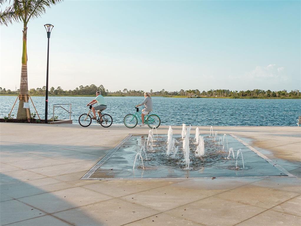 20219 Tesoro Drive Venice, FL 34293 - Photo 87 of 98 a view of a lake with a big yard and large trees