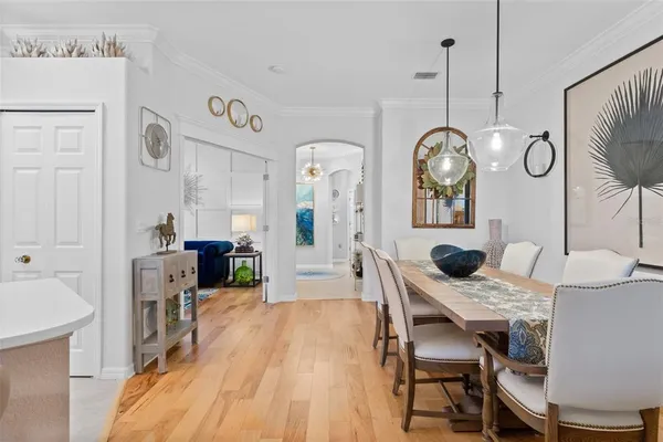 a view of a dining room with furniture window and wooden floor
