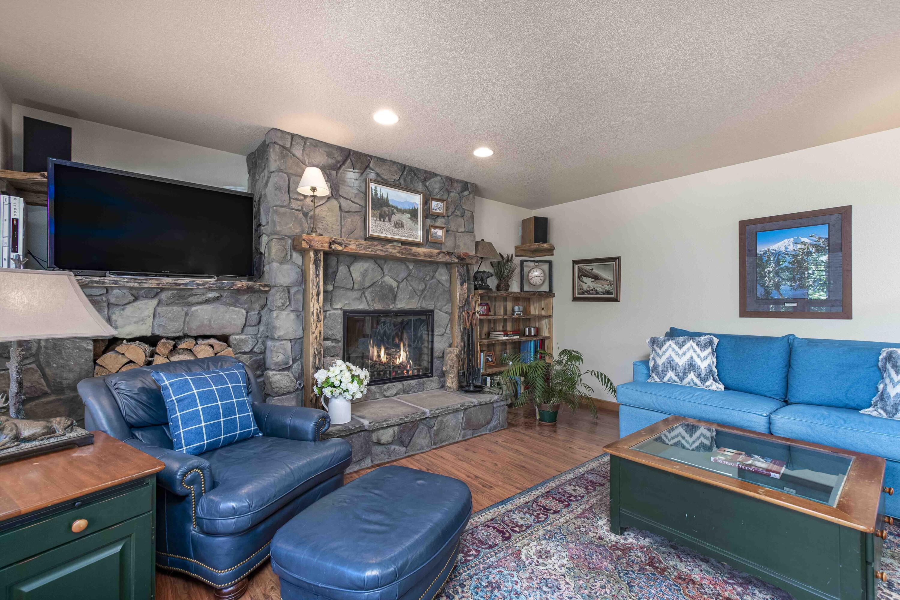 Spacious, yet cozy lodge-style family room downstairs and vaulted great room upstairs give this home wonderful flexibility for daily living or vacation rental!