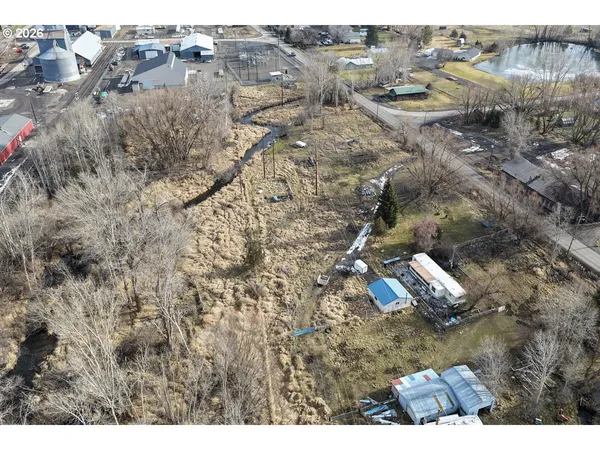 a view of a house with a car parked in it