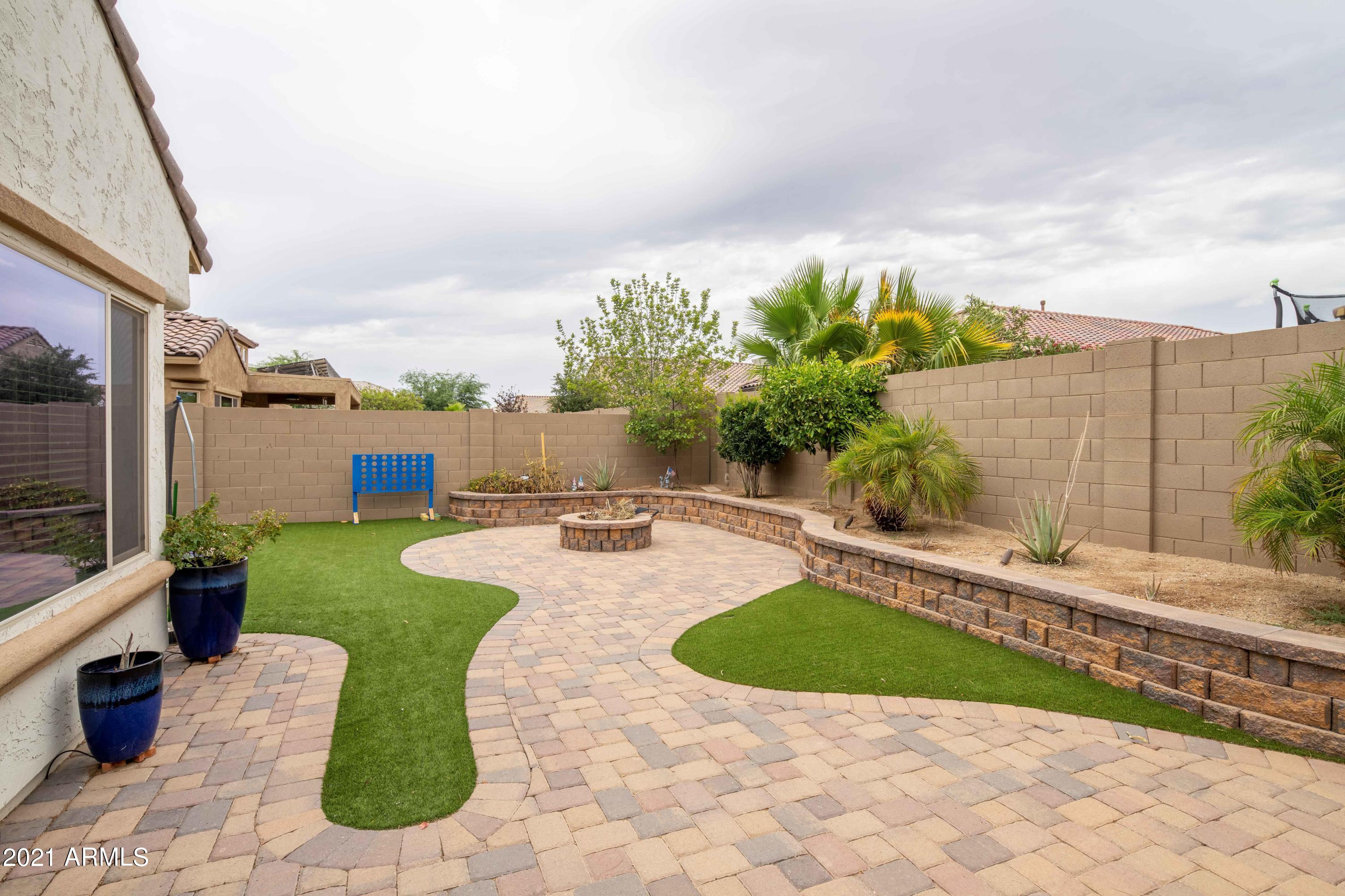 17456 West Bajada Road Surprise, AZ 85387 - Photo 28 of 39 Backyard wood fire pit different view