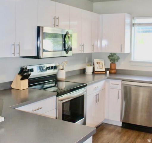 64 West 600 South, Unit C105 Springville, UT 84663 - Photo 5 of 11 Modern kitchen featuring white flat-panel cabinetry and stainless steel appliances