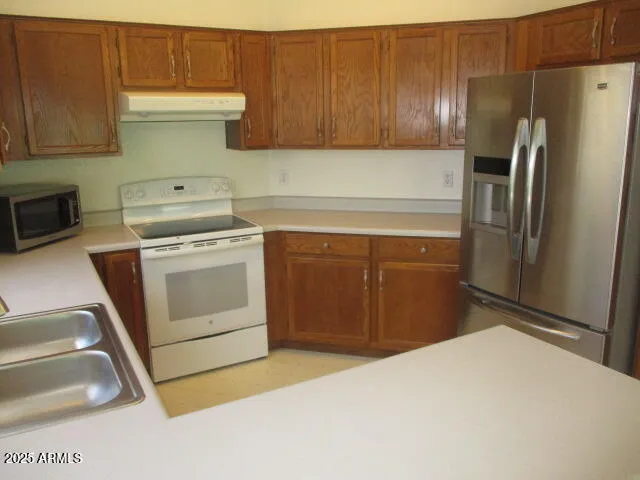 a kitchen with a sink and a window