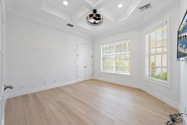 a spacious bathroom with a double vanity sink a large mirror and shower