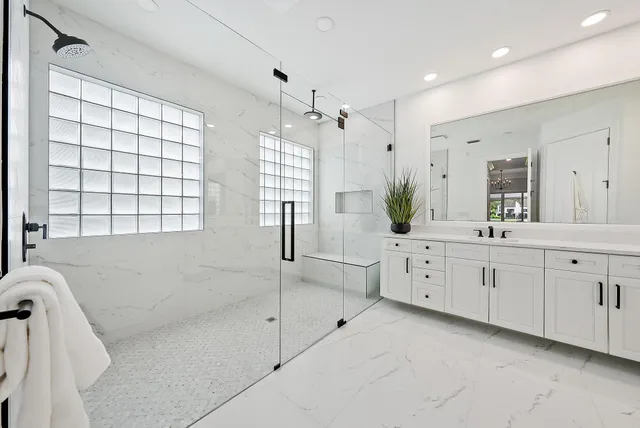 a spacious bedroom with a bed and a window