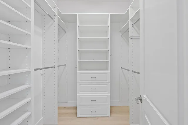 a bathroom with a shower sink and mirror