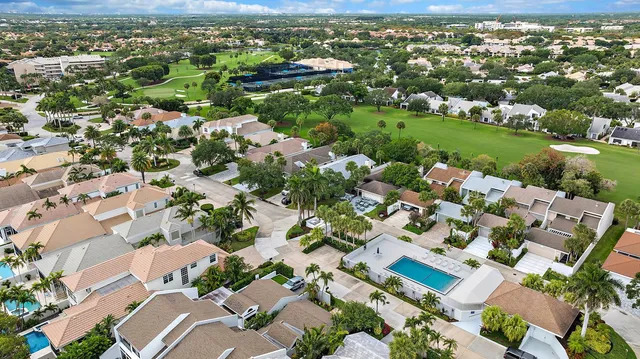 an aerial view of lake residential houses with outdoor space and trees