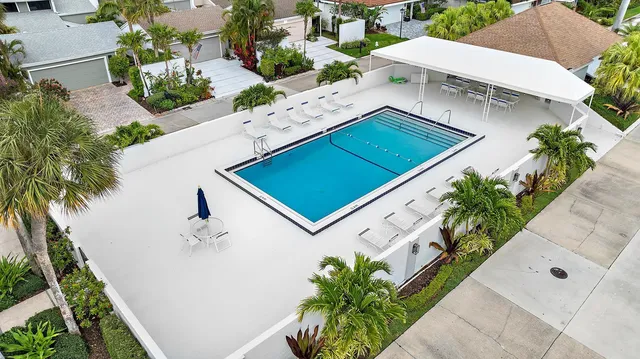 an aerial view of a house with a lake view