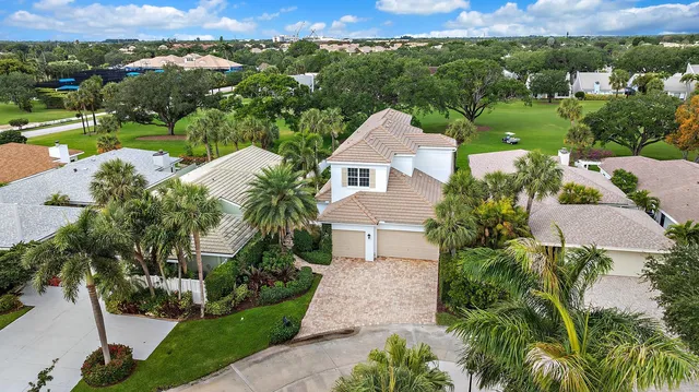 an aerial view of a house with yard swimming pool and outdoor seating