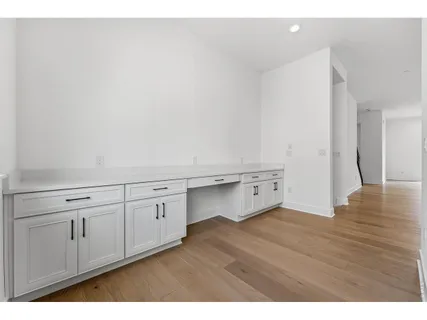 a bathroom with a sink mirror and toilet