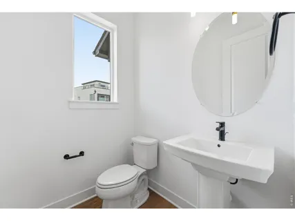a bedroom with a bed and a view of kitchen