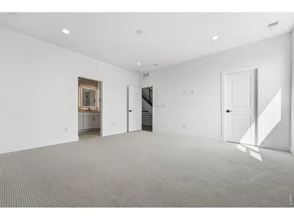 a bathroom with a double vanity sink and mirror