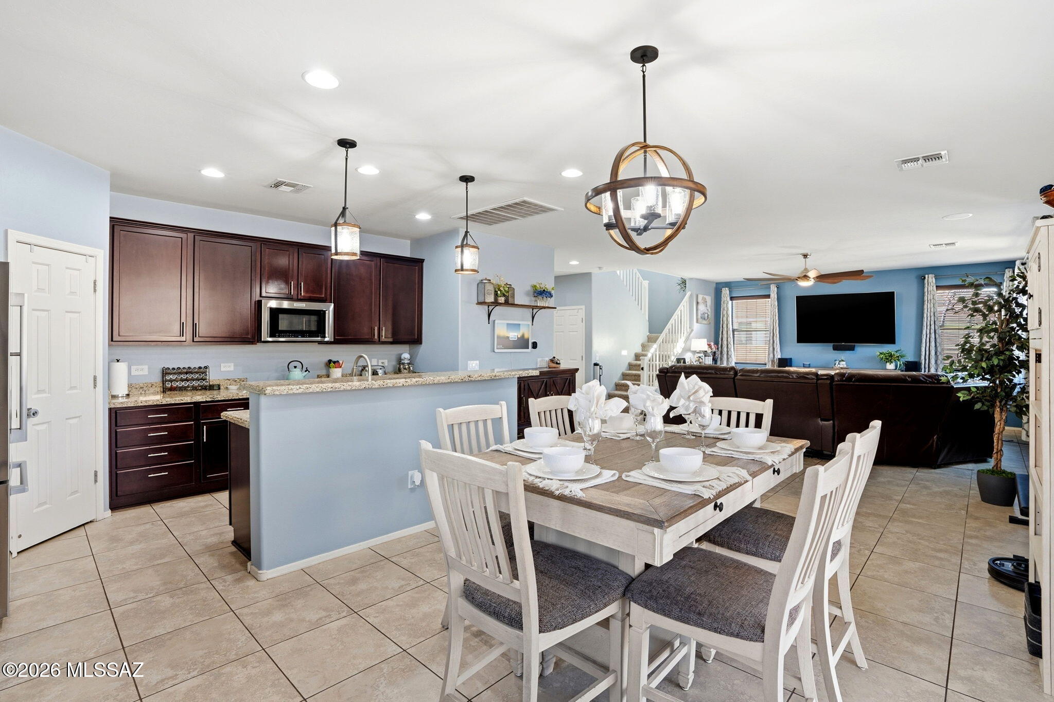 211 East Refuge Loop Vail, AZ 85641 - Photo 9 of 48 a view of kitchen with sink dining table and chairs