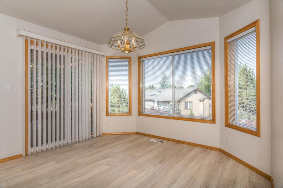 3207 Southwest 35th Street Redmond, OR 97756 - Photo 15 of 39 Large dining area with slider to outside deck