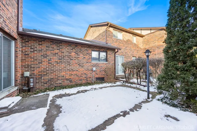 a view of a house with a small backyard