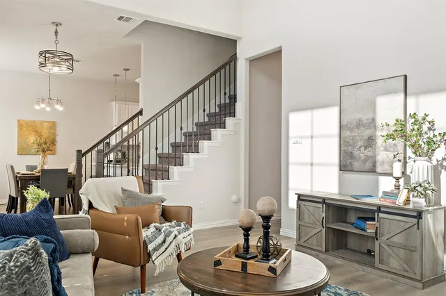 a living room with furniture and a table