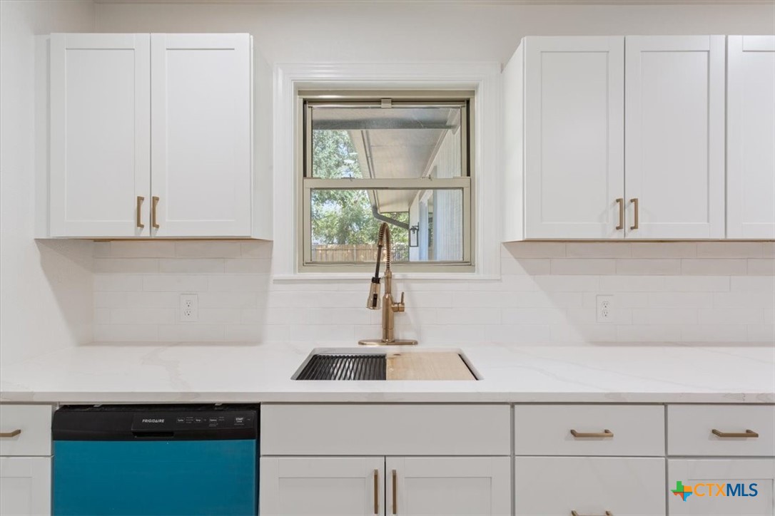 4412 Briar Cliff Road Temple, TX 76502 - Photo 12 of 28 a kitchen with a sink and cabinets