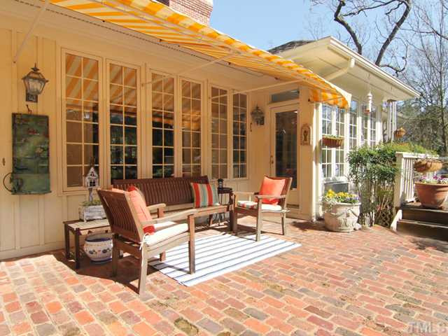 3511 Darwin Road Durham, NC 27707 - Photo 13 of 25 This covered Porch is where you want to be in the warm weather. The striped awning makes it ideal for sipping lemonade in the shade! The Deck is to the right. Porch