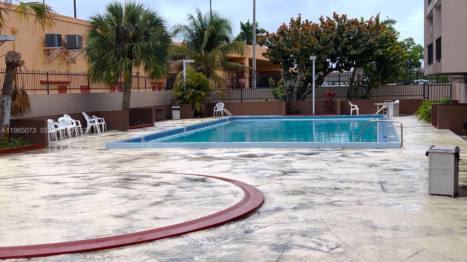1900 West 68th Street, Unit D207 Hialeah, FL 33014 - Photo 14 of 33 a view of outdoor space yard and patio
