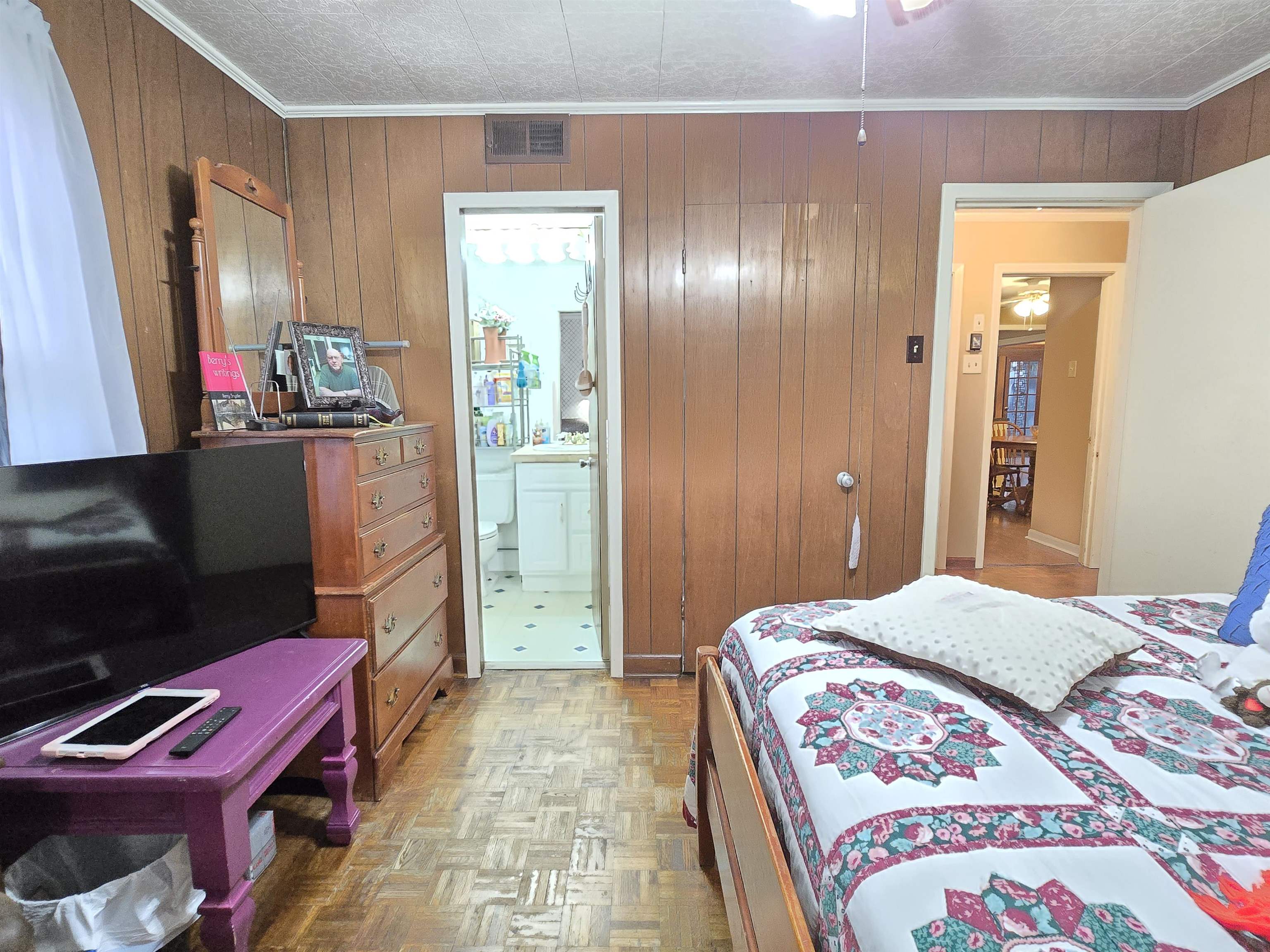 4885 Macon Road Memphis, TN 38122 - Photo 8 of 39 a bedroom with a bed and a flat screen tv