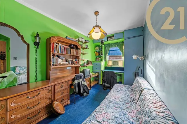 a bedroom with a bed dresser and a window