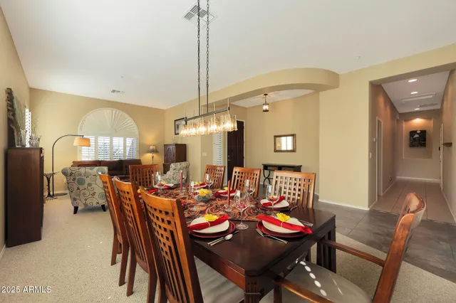 a kitchen with stainless steel appliances granite countertop a stove top oven a sink a counter top space and cabinets