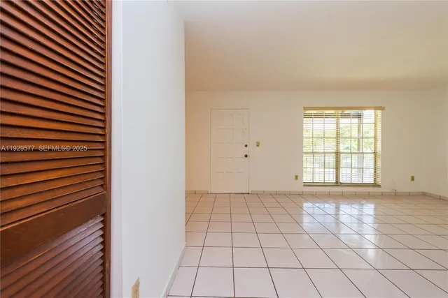 a view of an empty room and window