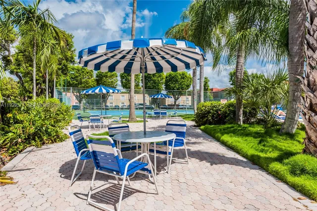 a view of a swimming pool with a patio